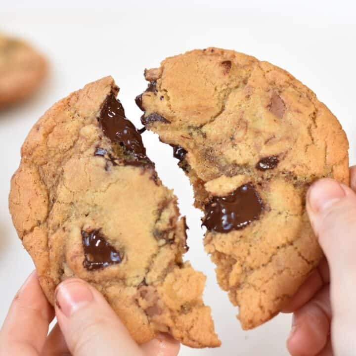Chocolate chunk cookie broken in half.