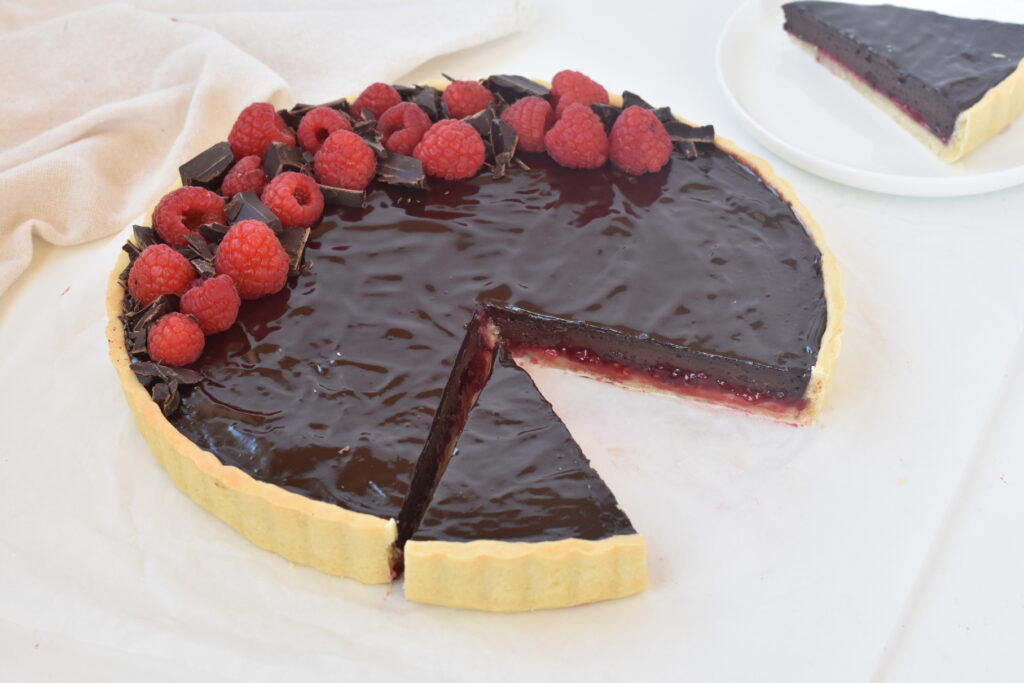 Tart as shown from front with one slice taken out.