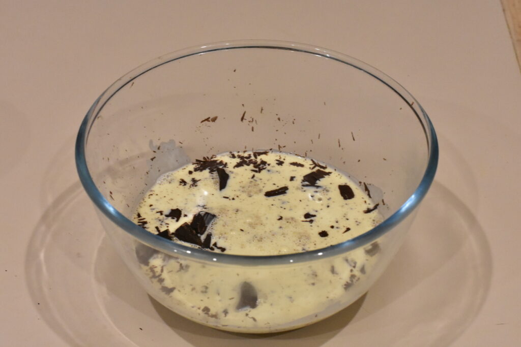 Cream, milk and chocolate in medium bowl.