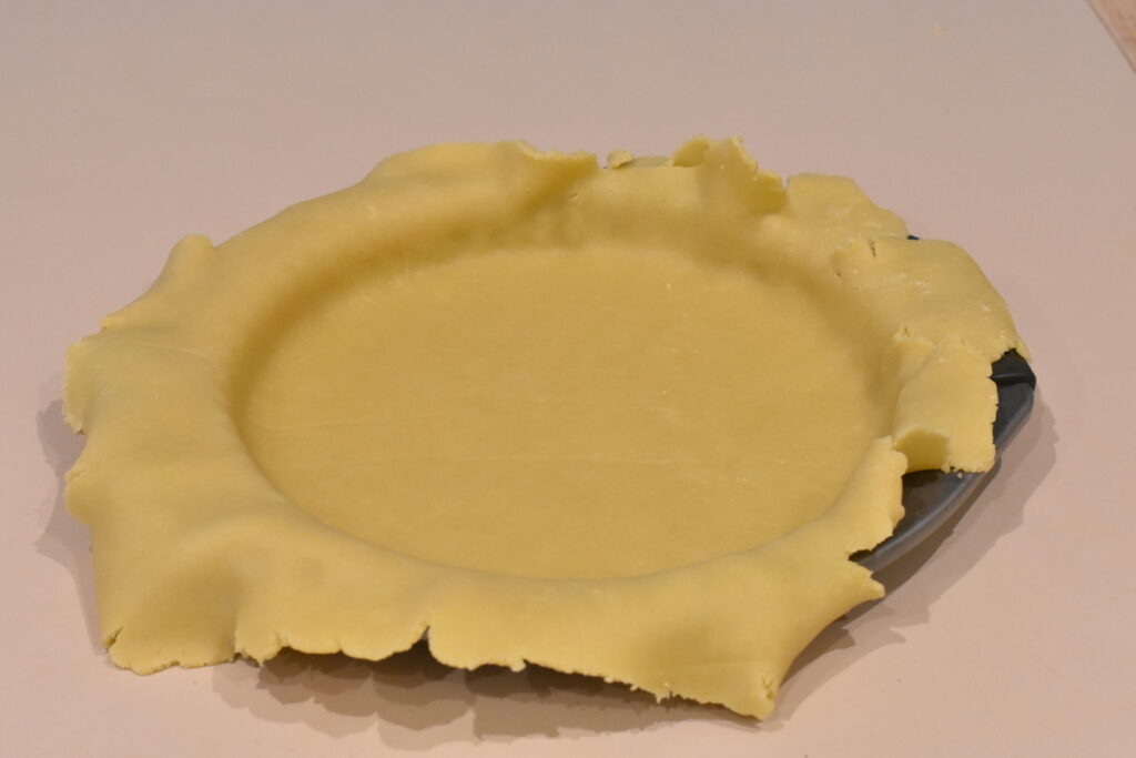 Tart dough flipped into tart tin.