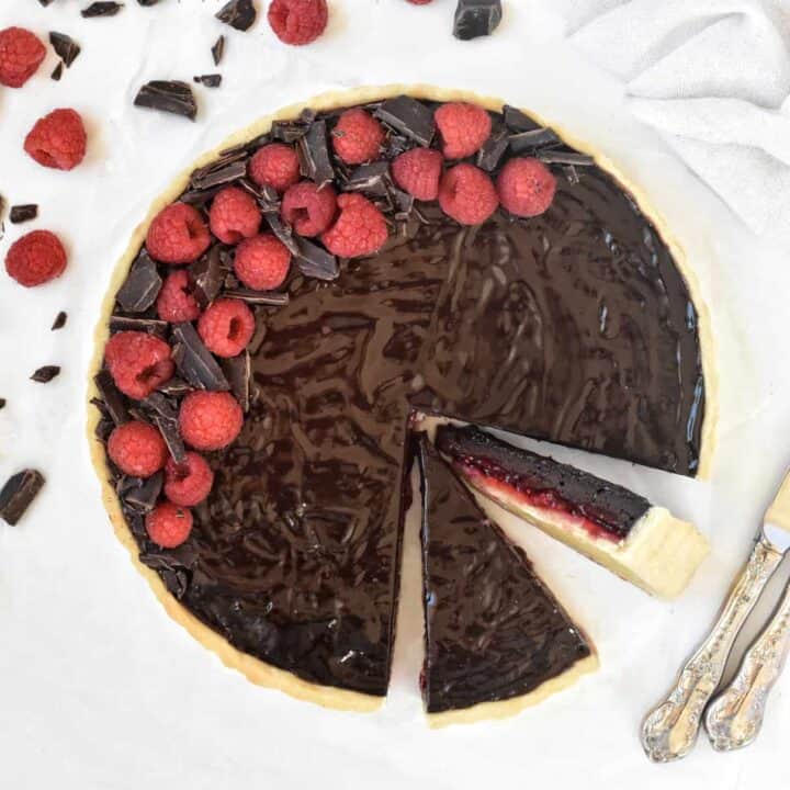 Chocolate Raspberry Tart with A Mirror Glaze sliced view from above.
